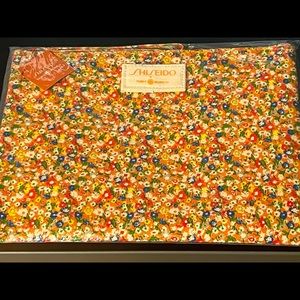 Shiseido x Tory Burch wristlet/pouch